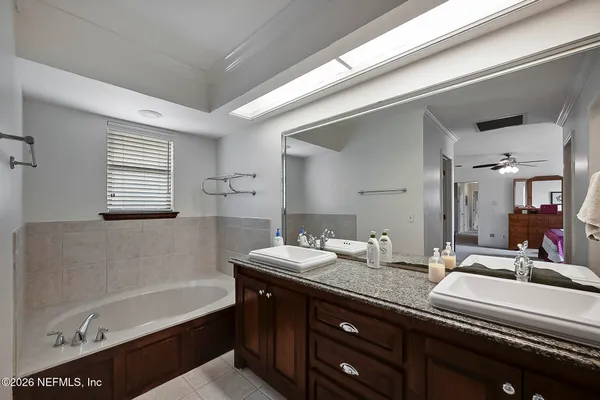 a bathroom with a bathtub and a sink