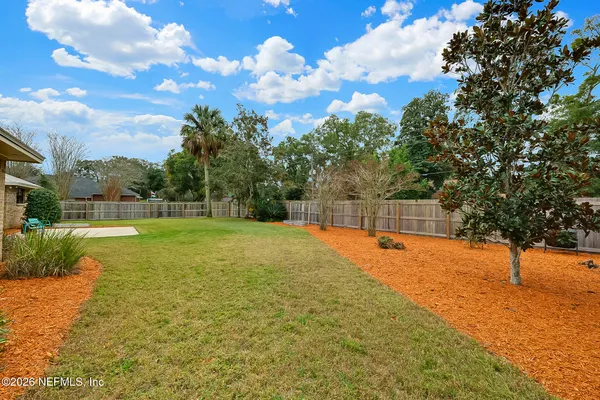 a backyard of a house with lots of green space