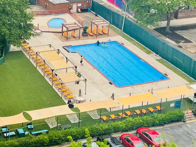 an aerial view of a house with a swimming pool