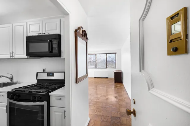 a kitchen with a stove and a microwave