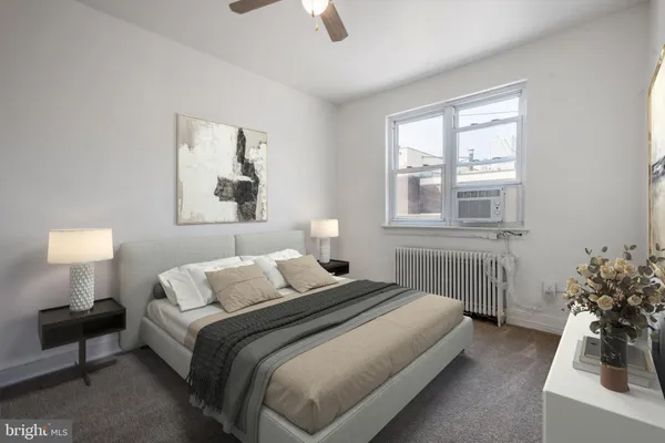 a bedroom with a bed and a bathroom