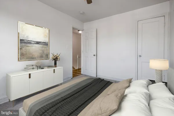 a roof deck with couches and potted plants with sky view