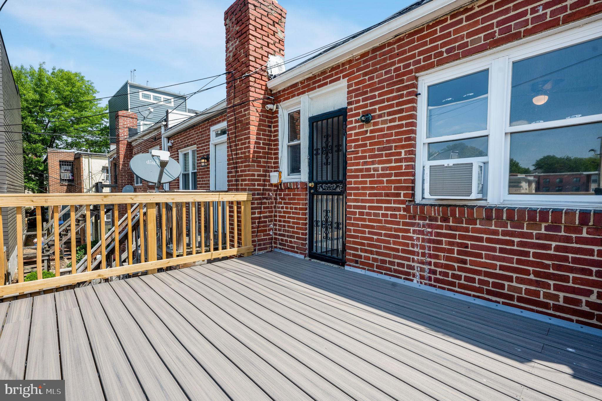 2538 9th Street Northwest, Unit B Washington, DC 20001 - Photo 19 of 19 a view of a wooden deck with large windows