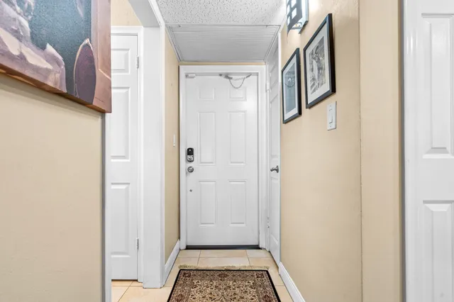 a view of a hallway with a white walls