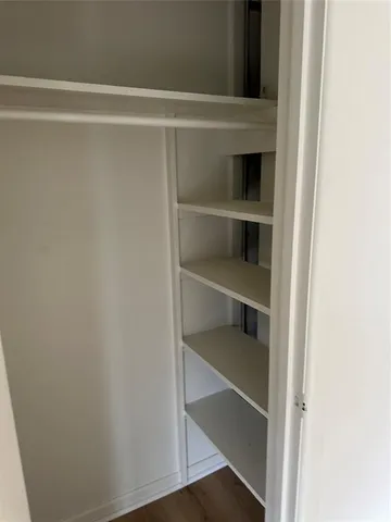 a view of a room with rack on the wall