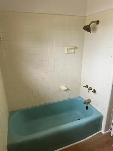 a bathroom with a bath tub