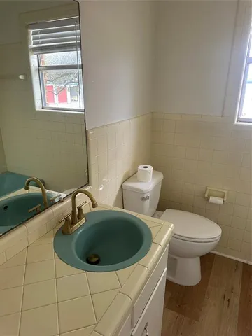 a bathroom with a toilet and a sink