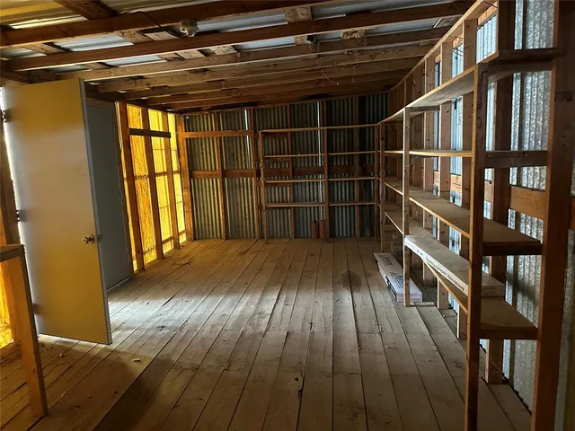 a view of balcony with wooden floor