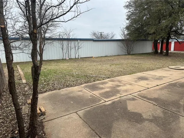 a view of a backyard of the house