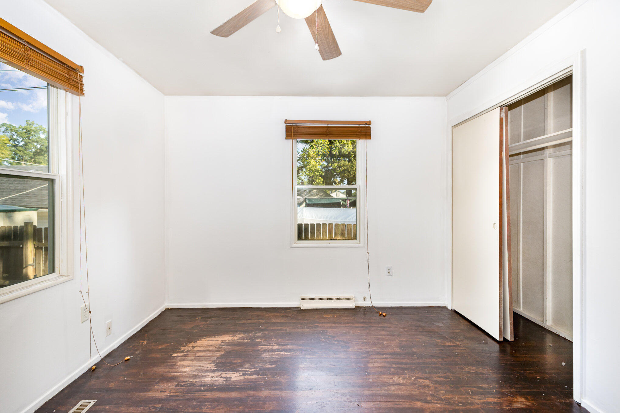 2108 Pear Street Michigan City, IN 46360 - Photo 11 of 25 an empty room with wooden floor and windows
