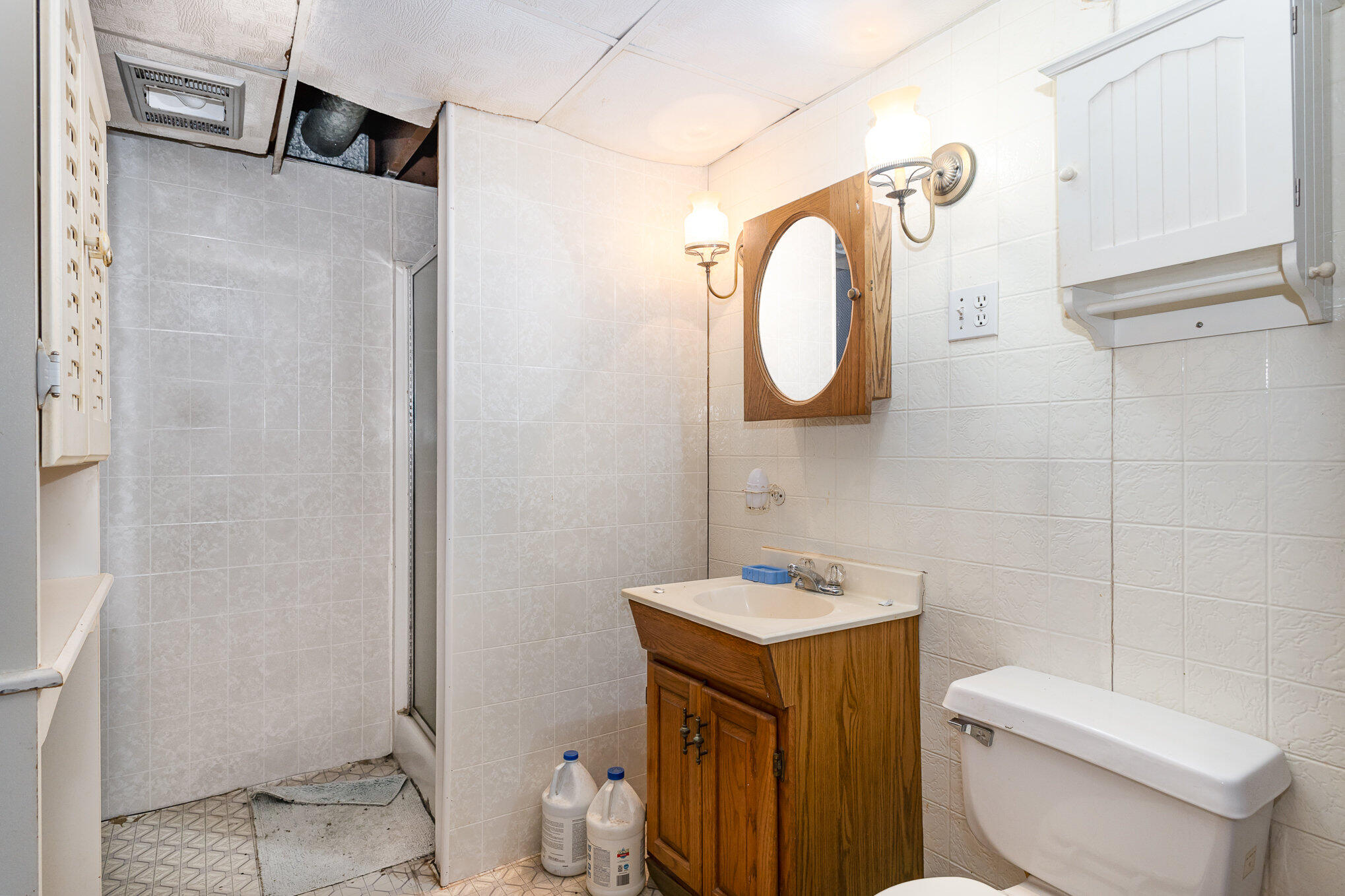 2108 Pear Street Michigan City, IN 46360 - Photo 19 of 25 a bathroom with a sink a toilet and a mirror