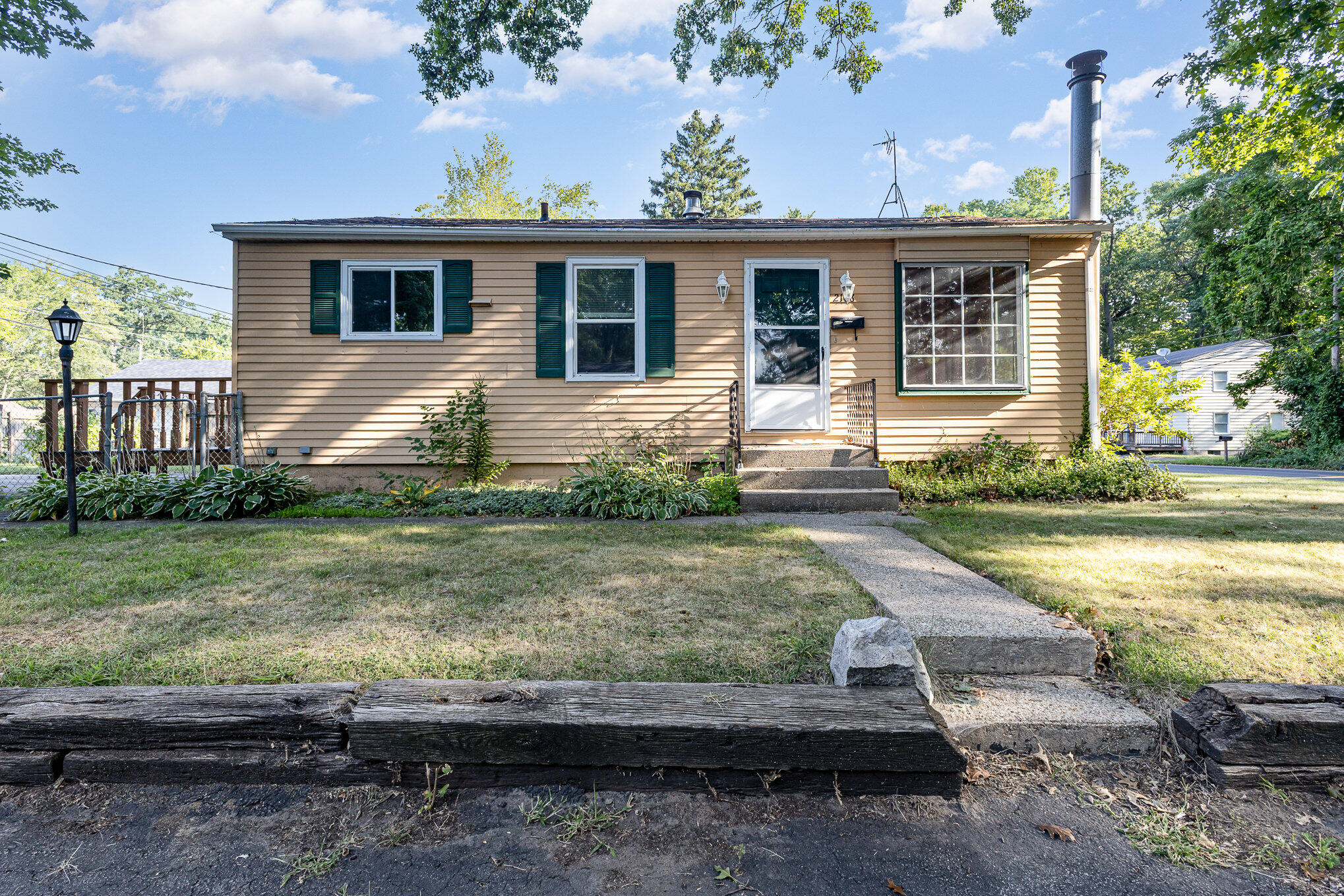 2108 Pear Street Michigan City, IN 46360 - Photo 2 of 25 a front view of a house with garden