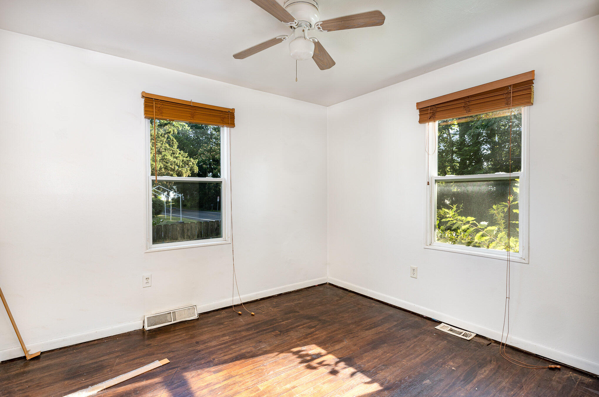 2108 Pear Street Michigan City, IN 46360 - Photo 8 of 25 an empty room with window and hardwood floor