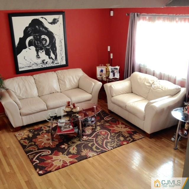 198 McFarlane Road Colonia, NJ 07067 - Photo 2 of 22 a living room with furniture and a rug