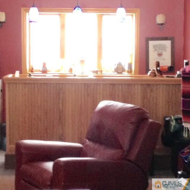 198 McFarlane Road Colonia, NJ 07067 - Photo 12 of 22 a living room with furniture and a window