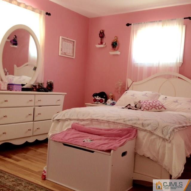 198 McFarlane Road Colonia, NJ 07067 - Photo 14 of 22 a bedroom with a bed and a dresser