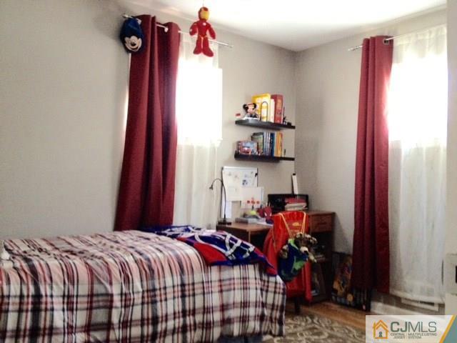 198 McFarlane Road Colonia, NJ 07067 - Photo 17 of 22 a bed room with a bed and a closet