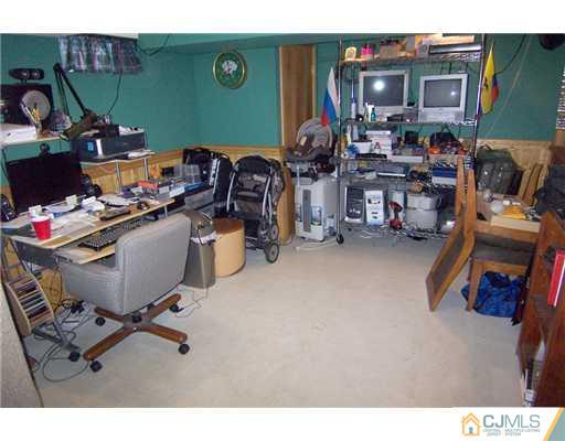 198 McFarlane Road Colonia, NJ 07067 - Photo 20 of 22 a view of a workspace with furniture and a window