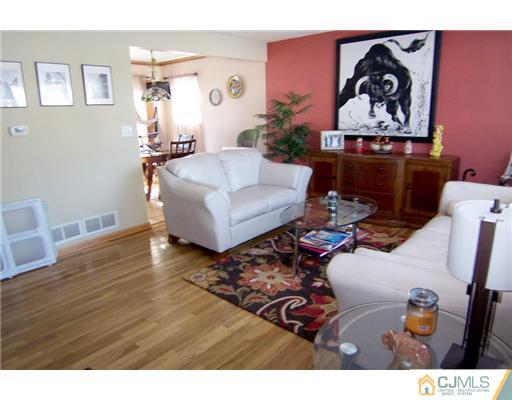 198 McFarlane Road Colonia, NJ 07067 - Photo 3 of 22 a living room with furniture and wooden floor