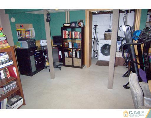 198 McFarlane Road Colonia, NJ 07067 - Photo 21 of 22 a view of a bedroom with workspace and stairs