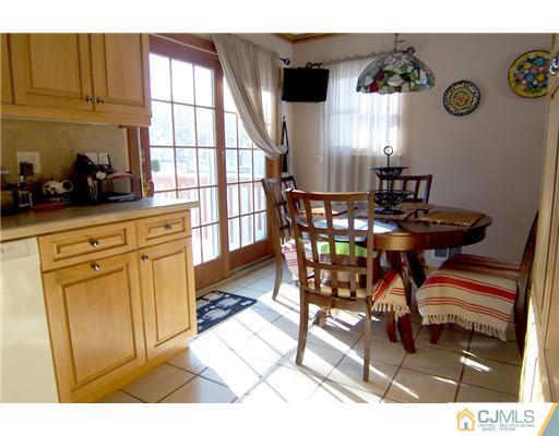 198 McFarlane Road Colonia, NJ 07067 - Photo 5 of 22 a view of a dining room with furniture and chandelier