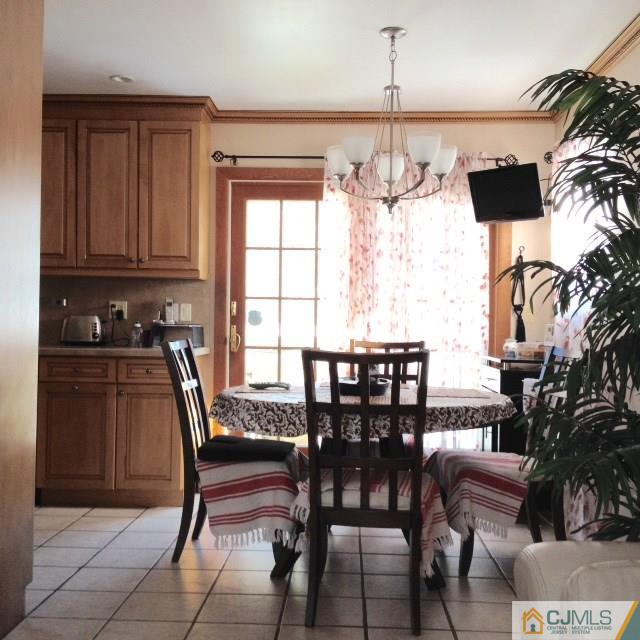 198 McFarlane Road Colonia, NJ 07067 - Photo 7 of 22 a view of a dining room with furniture and chandelier