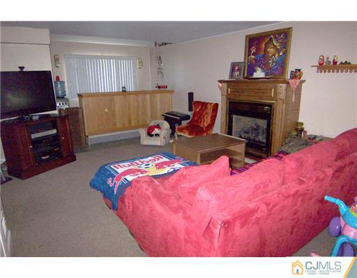 198 McFarlane Road Colonia, NJ 07067 - Photo 10 of 22 a bedroom with a bed and a television