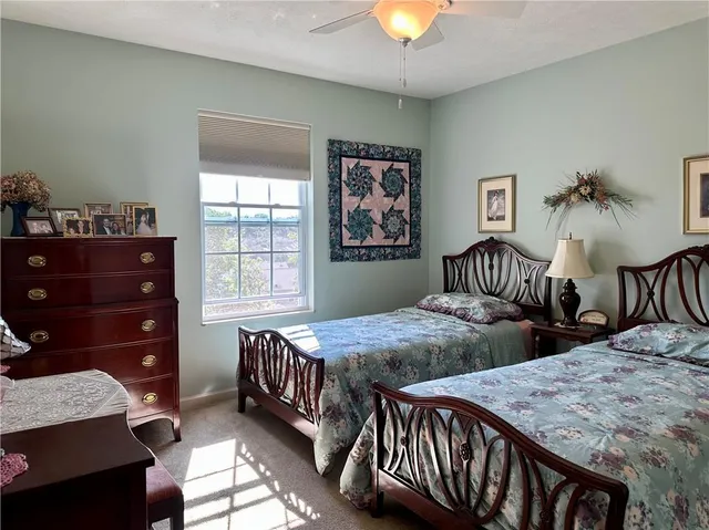 a bedroom with two beds and a table