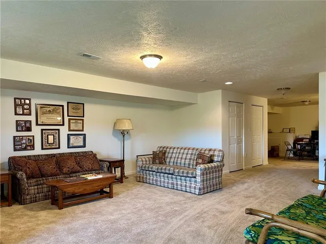 a living room with couch and a bookshelf