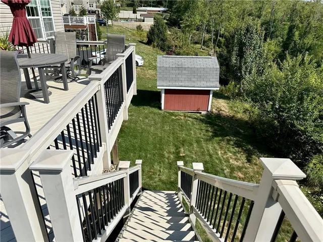 a view of balcony with furniture