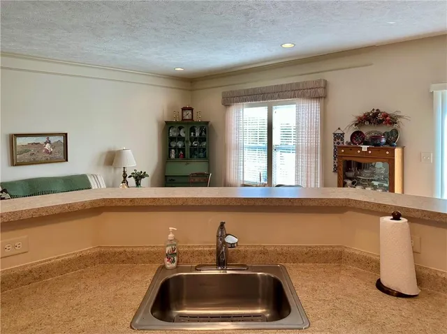 a kitchen with a sink and a window