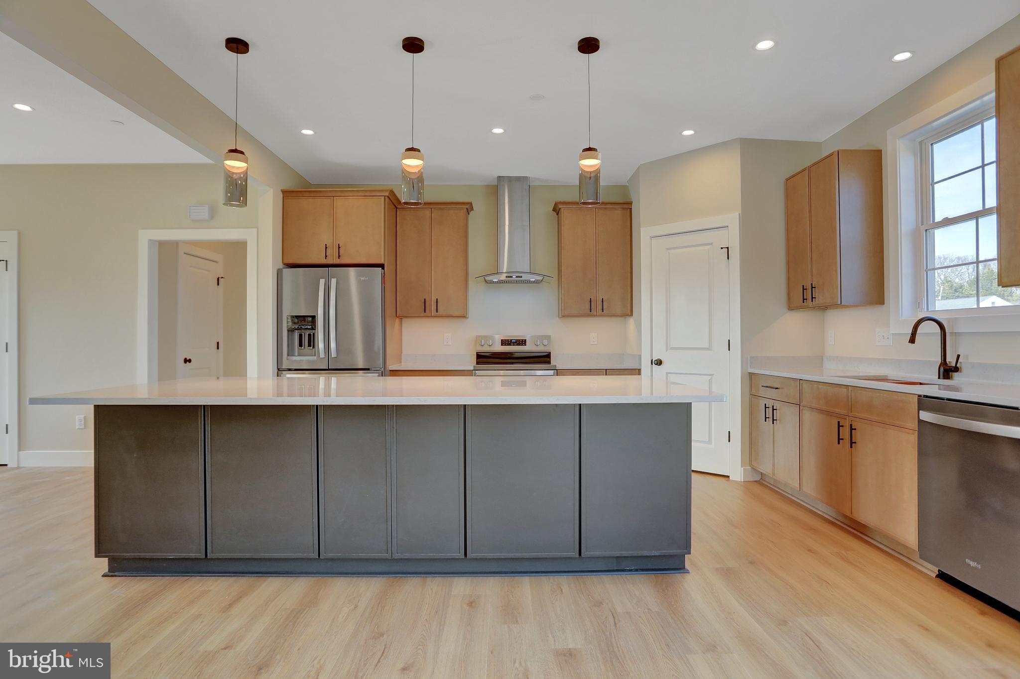 3542 Revolea Beach Road Middle River, MD 21220 - Photo 11 of 28 a large kitchen with cabinets