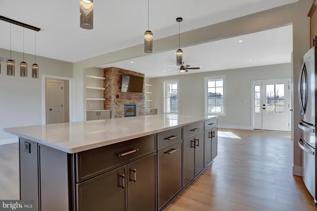 a kitchen with stainless steel appliances a sink and a refrigerator