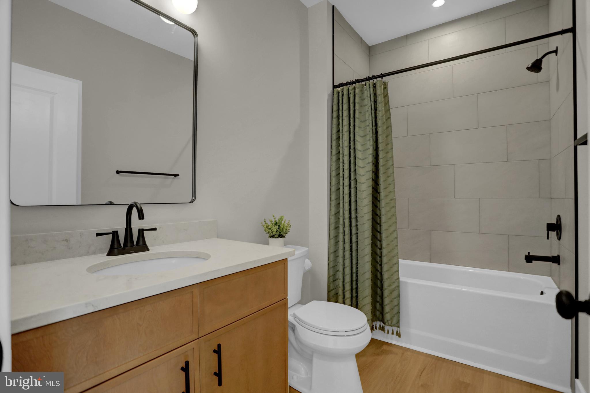 3542 Revolea Beach Road Middle River, MD 21220 - Photo 23 of 28 a bathroom with a sink a toilet and shower