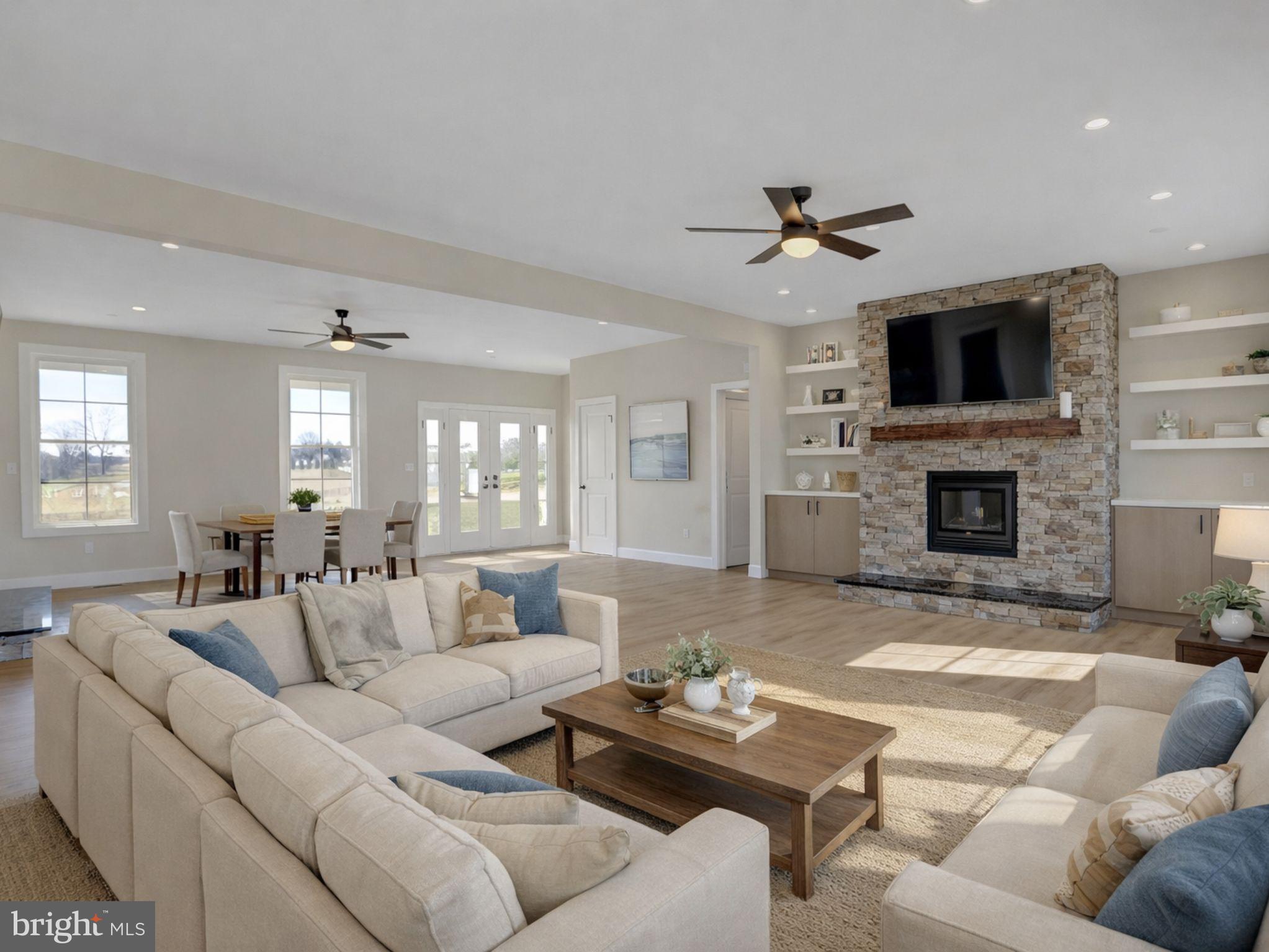 3542 Revolea Beach Road Middle River, MD 21220 - Photo 3 of 28 a living room with furniture fireplace and a flat screen tv