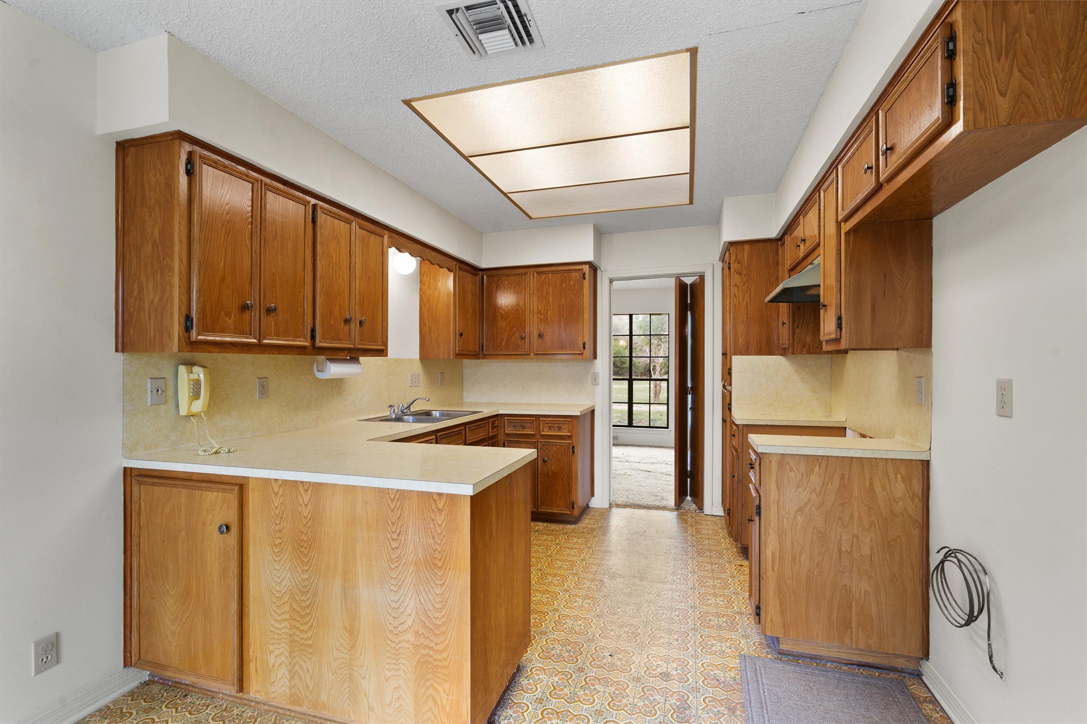 422 Patricia Road Georgetown, TX 78628 - Photo 11 of 39 a kitchen with stainless steel appliances granite countertop a refrigerator a stove and a sink with wooden floor
