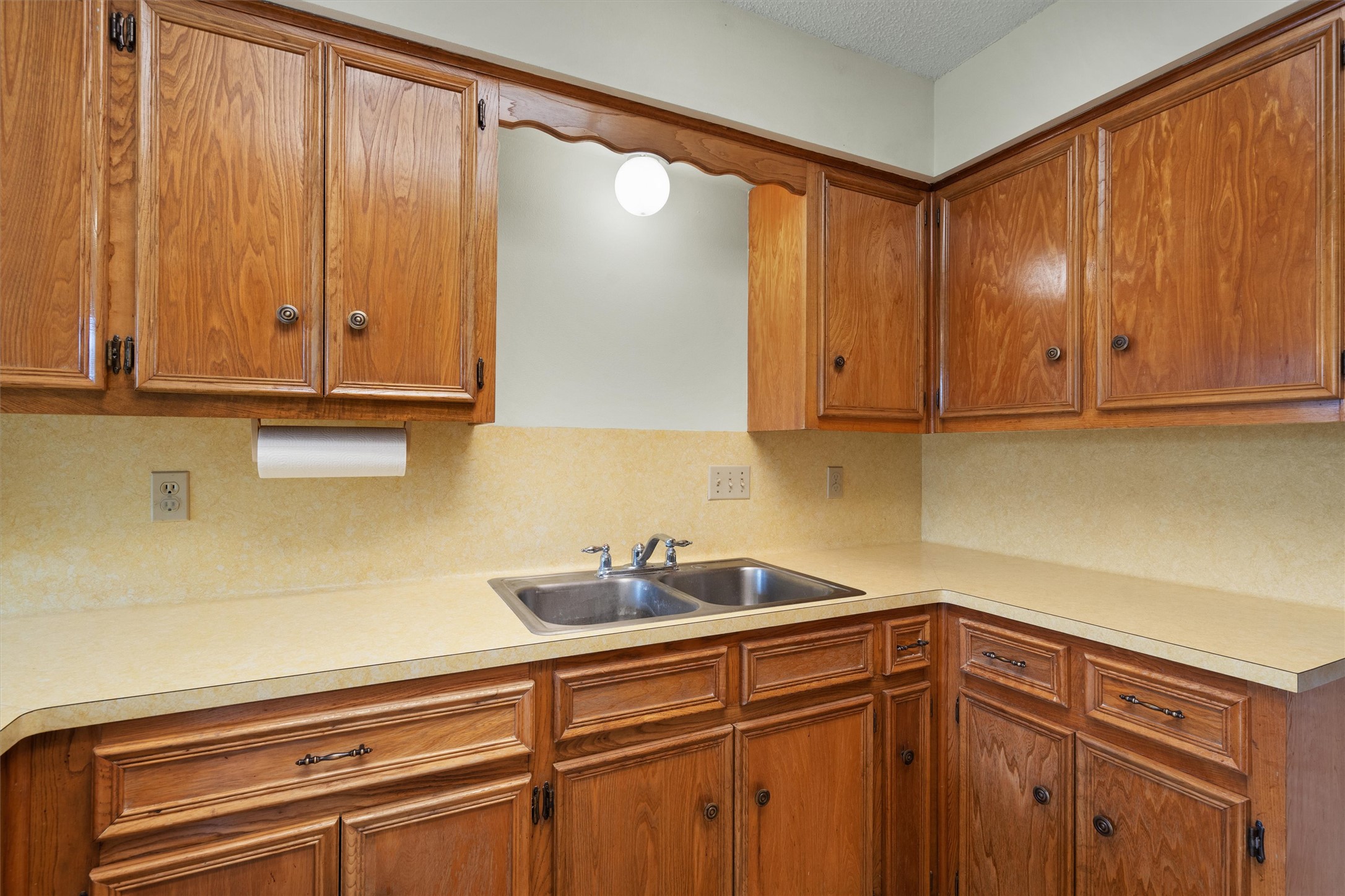 422 Patricia Road Georgetown, TX 78628 - Photo 12 of 39 a kitchen with stainless steel appliances granite countertop wooden cabinets and a sink
