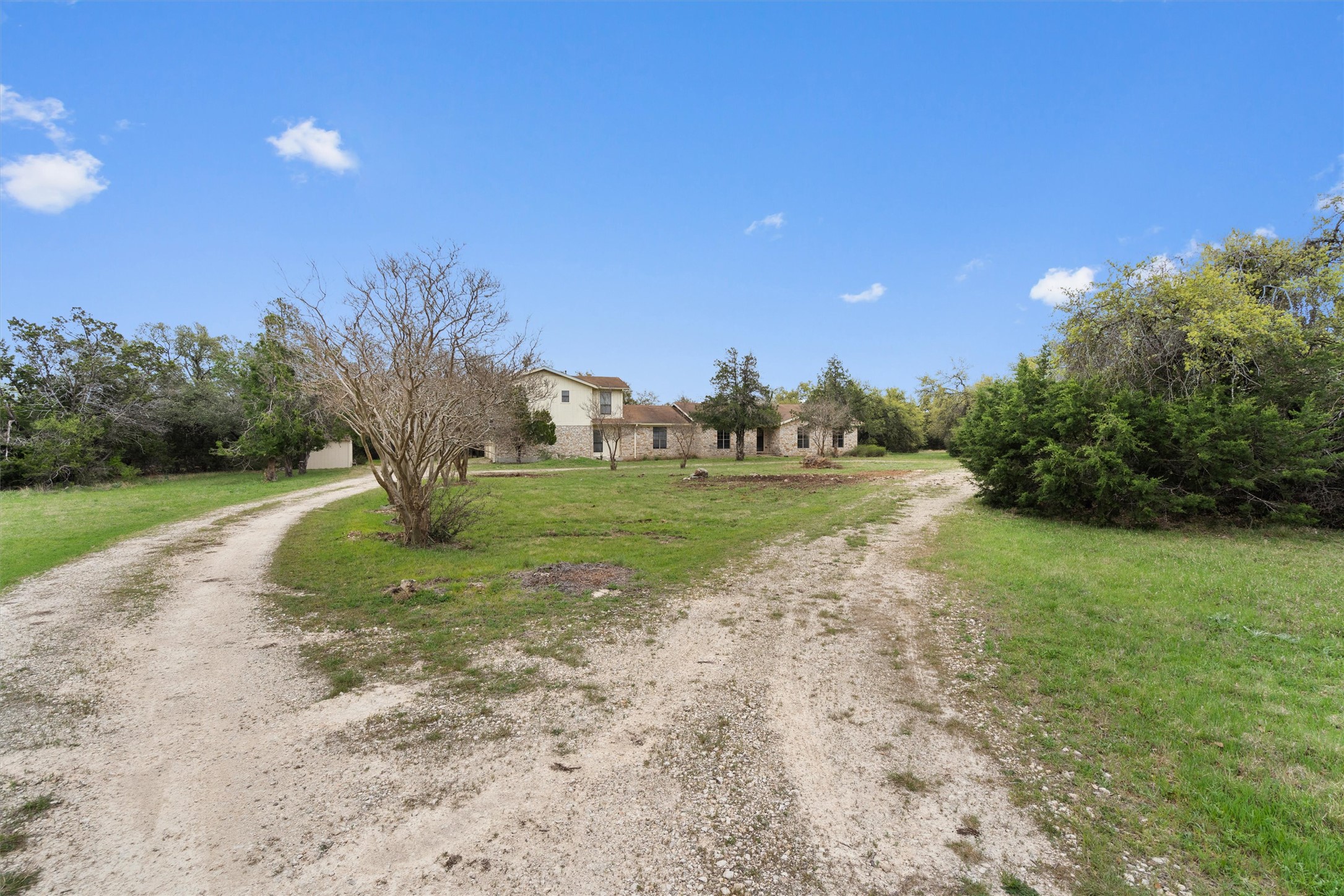 422 Patricia Road Georgetown, TX 78628 - Photo 2 of 39 a view of a field with grass and a trees