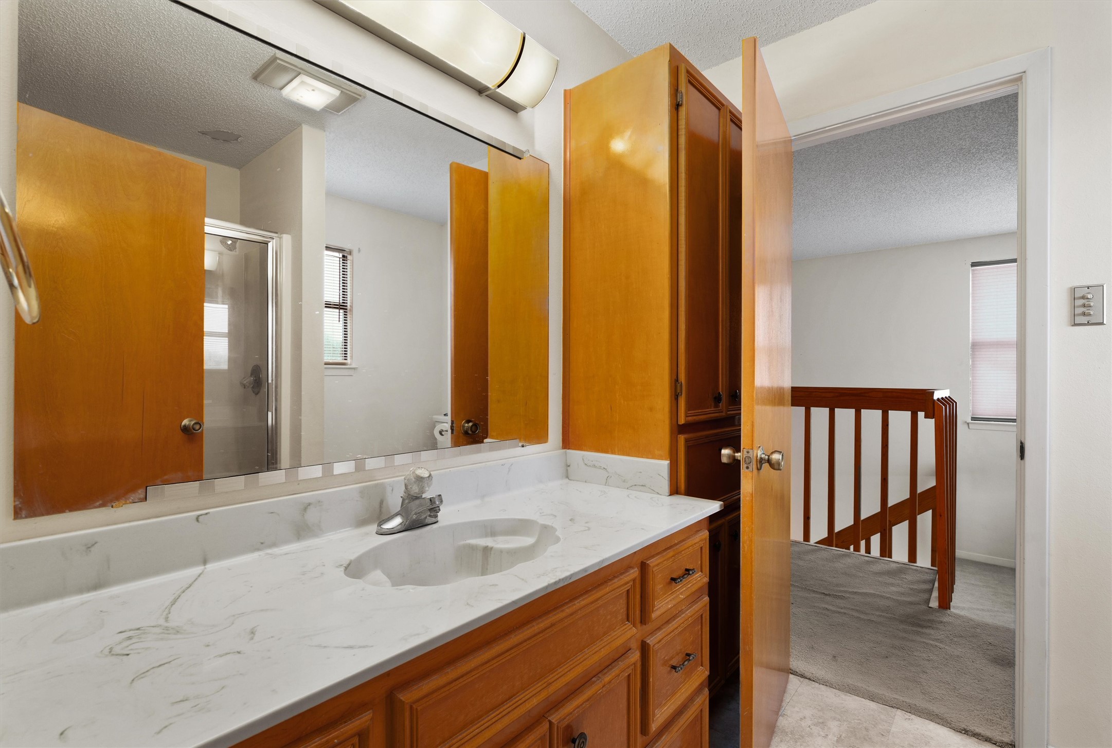 422 Patricia Road Georgetown, TX 78628 - Photo 30 of 39 a bathroom with a granite countertop sink and a mirror