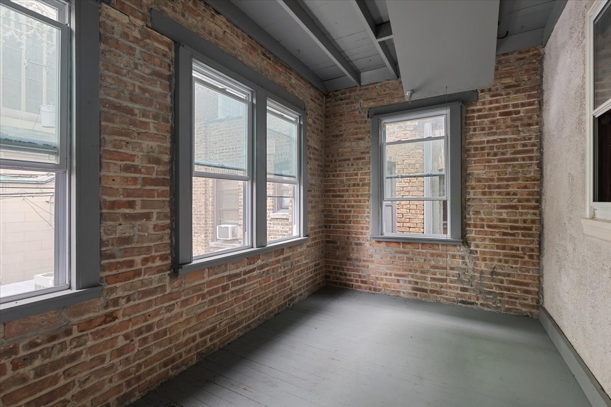 2062 North Damen Avenue Chicago, IL 60647 - Photo 18 of 26 a view of an empty room with a window
