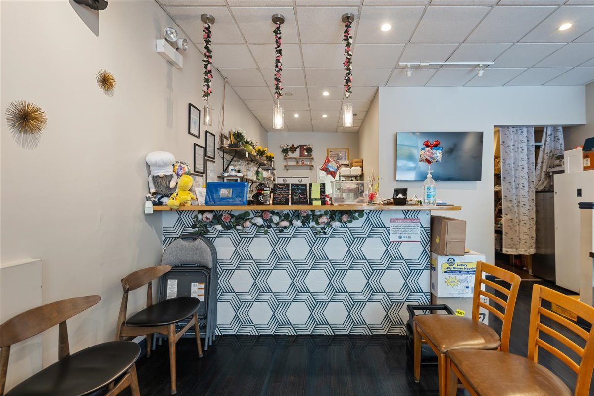 2062 North Damen Avenue Chicago, IL 60647 - Photo 19 of 26 a living room with furniture and a chandelier