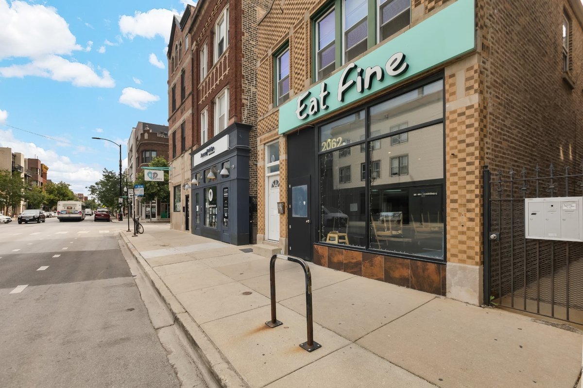 2062 North Damen Avenue Chicago, IL 60647 - Photo 2 of 26 a street sign on a street corner