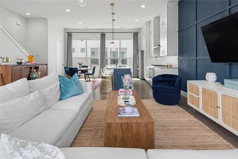 a living room with fireplace furniture and a flat screen tv