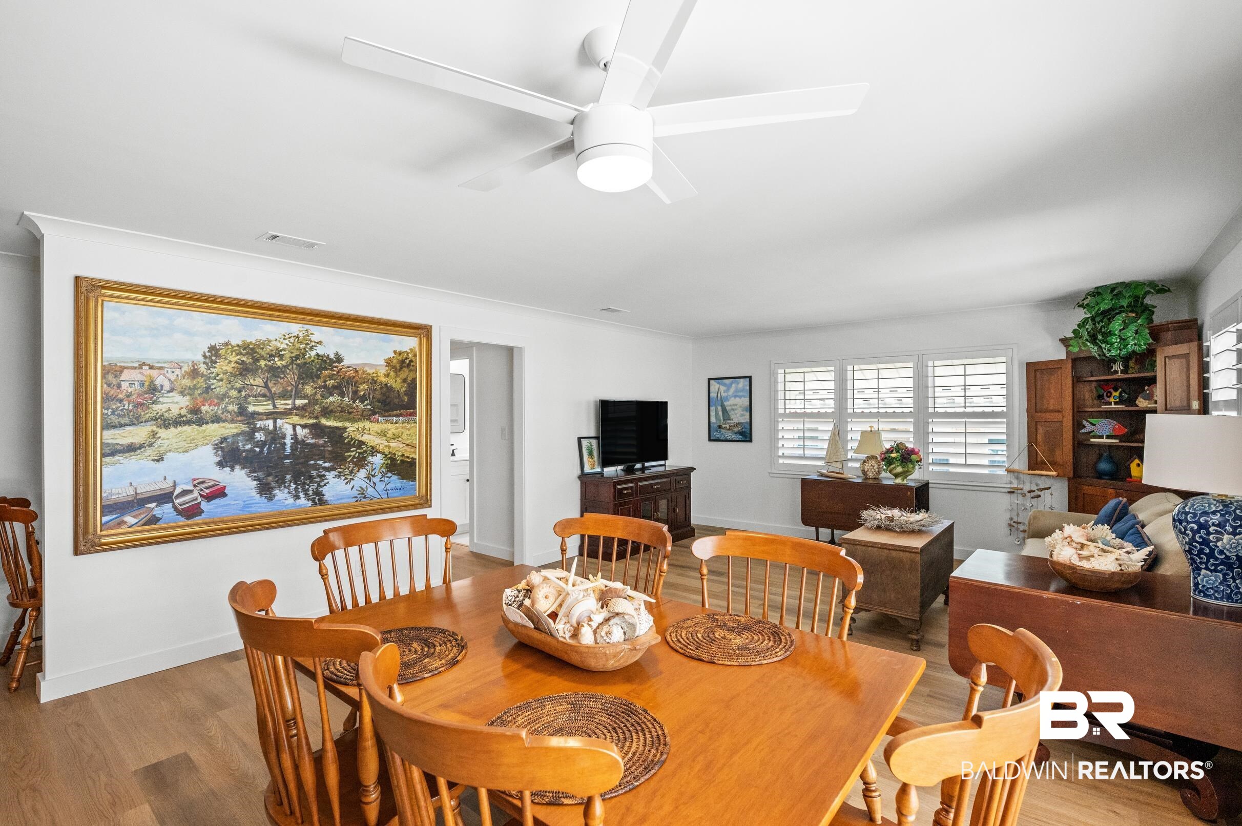 9459 Soldier Creek Road Lillian, AL 36549 - Photo 12 of 54 Dining space with light wood-type flooring, ceiling fan, and baseboards