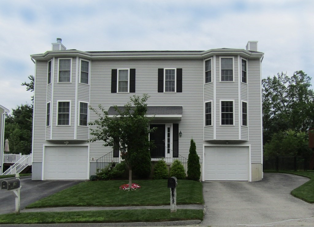 21 Honeysuckle Road Worcester, MA 01607 - Photo 1 of 38 a front view of a house with a yard and potted plants