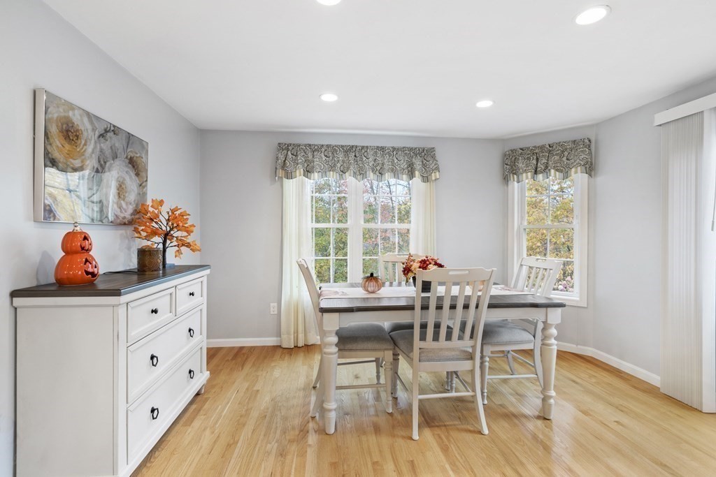 21 Honeysuckle Road Worcester, MA 01607 - Photo 17 of 38 a view of a dining room with furniture a chandelier and wooden floor