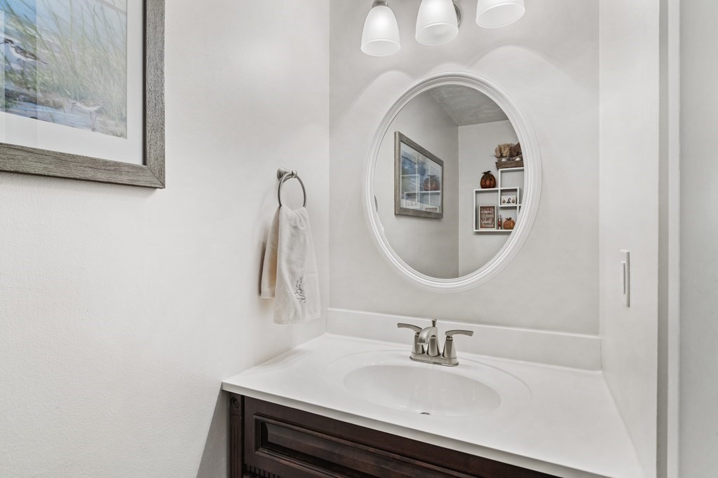21 Honeysuckle Road Worcester, MA 01607 - Photo 19 of 38 a bathroom with a sink and a mirror