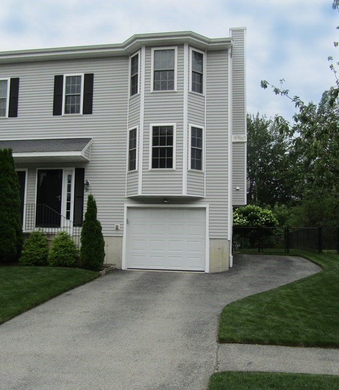 21 Honeysuckle Road Worcester, MA 01607 - Photo 2 of 38 a front view of a house with a yard and trees