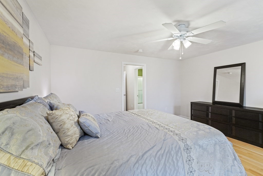 21 Honeysuckle Road Worcester, MA 01607 - Photo 22 of 38 a bedroom with a large bed and a dresser