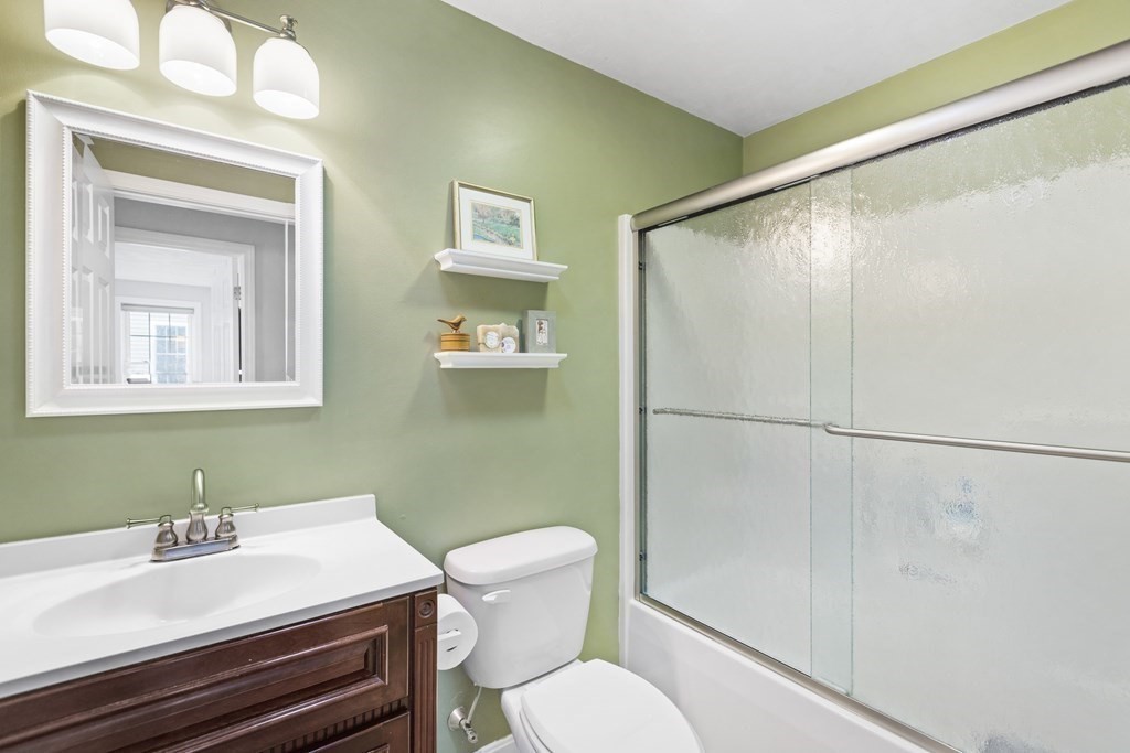 21 Honeysuckle Road Worcester, MA 01607 - Photo 26 of 38 a bathroom with a sink mirror vanity and toilet